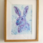 framed picture of a portrait of a hare in blue and purple inks